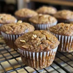 Close-up view of healthy muffins with a golden-brown top and a moist texture.