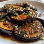 Close-up view of Keto Aubergine mit Hackfleisch, showcasing layered eggplant and ground meat.