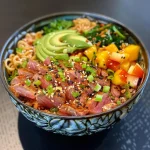 ['Close-up view of a vibrant Thunfisch bowl featuring tuna, mango, and vegetables.', 'Side view of a delicious Thunfisch bowl showcasing fresh ingredients like avocado and mango.', 'Colorful Thunfisch bowl with tuna, mango cubes, and broccoli arranged artfully.', 'Tasty Thunfisch bowl filled with juicy tuna, sliced avocado, and bright mango pieces.']