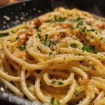 A close-up view of a bowl of One-Pot Linguine with chanterelles, showcasing its rich textures and vibrant colors.