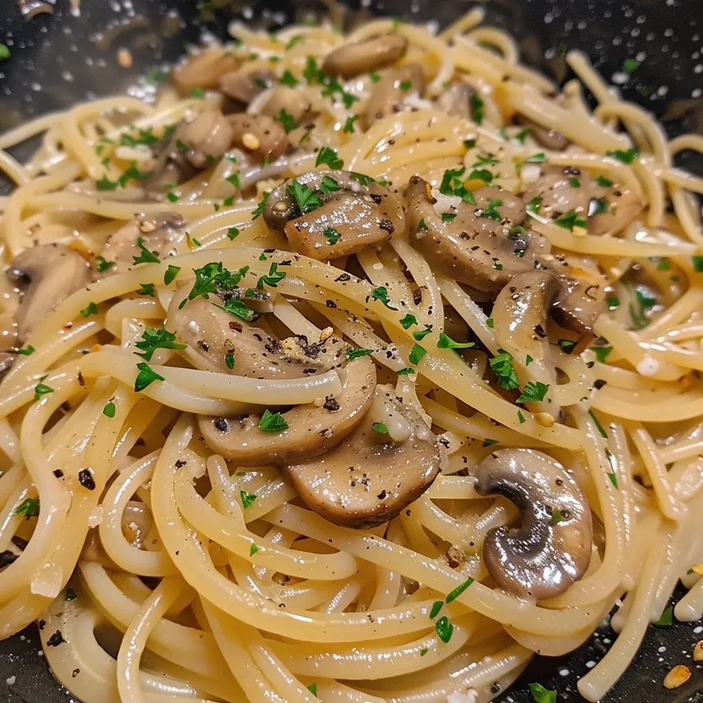 Side view of a delicious One-Pot Linguine with sautéed chanterelles and fresh herbs in a bowl.
